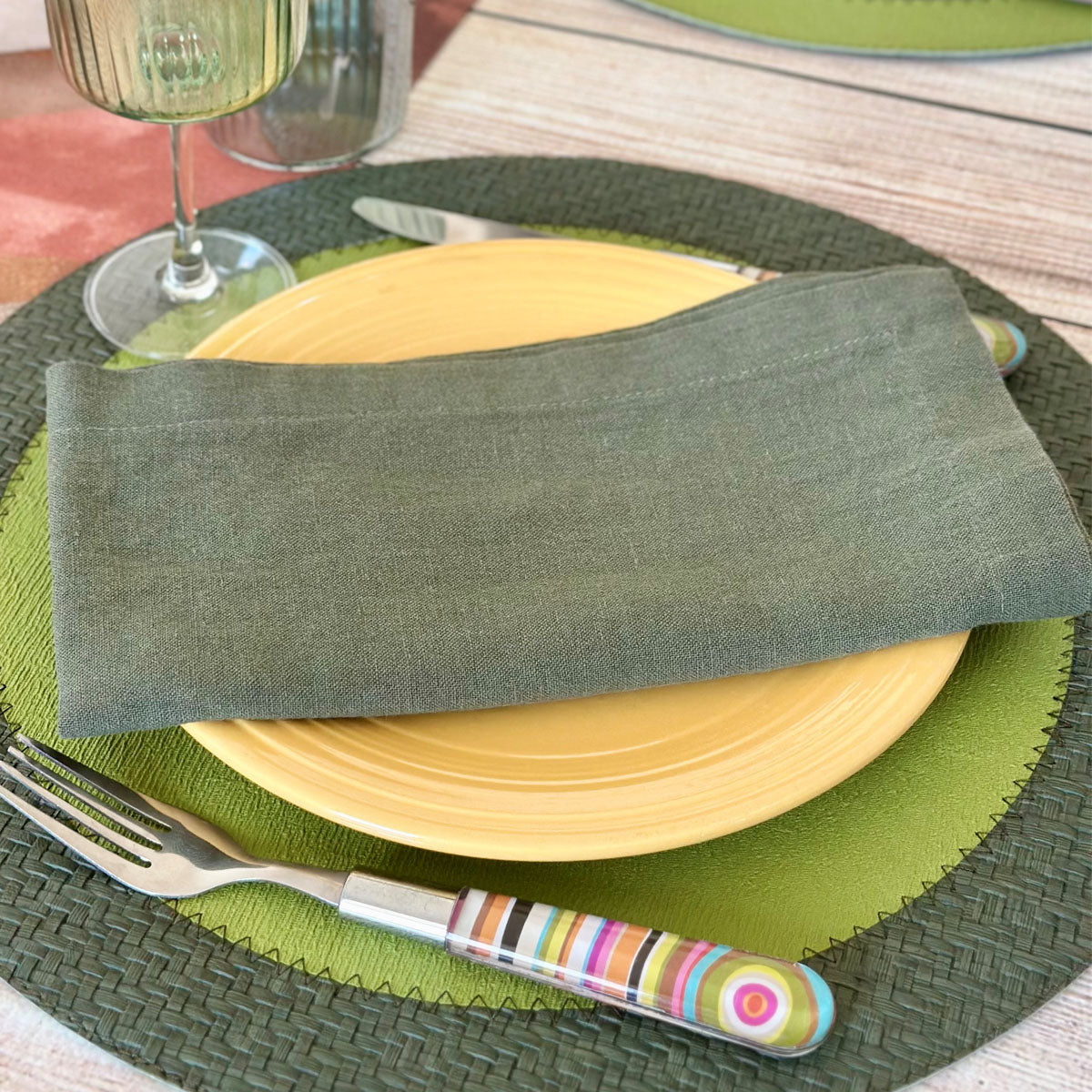 Stonewashed linen and cotton blend napkin in olive color